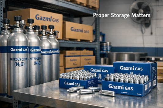 Gazmi Gas nitrous oxide cylinders and cartridges stored upright in an organized warehouse environment.