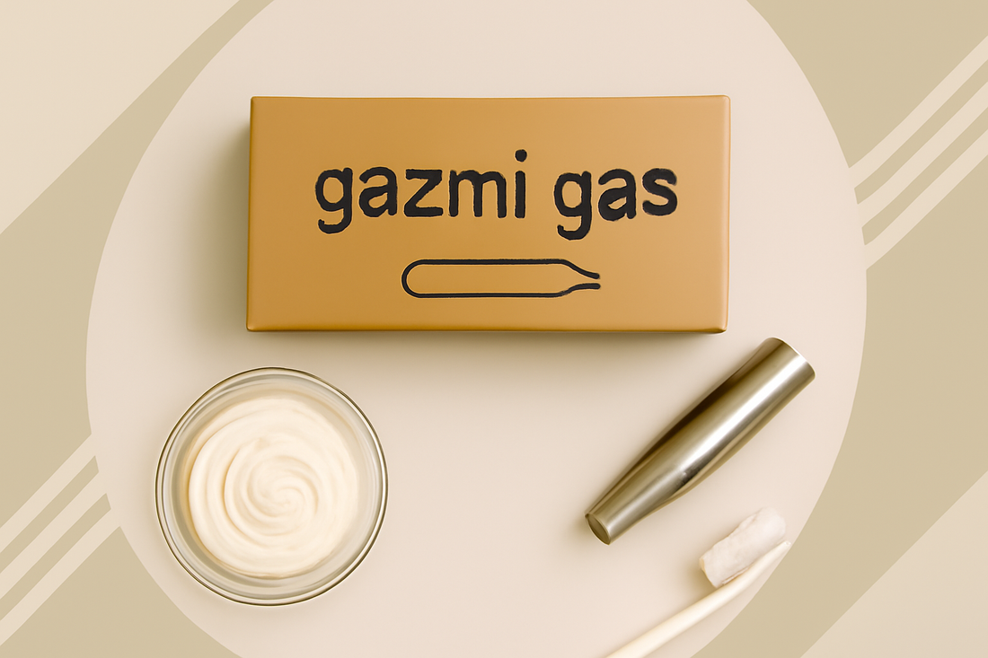Gazmi Gas cream charger kit with whipped cream, stainless steel nozzle, glass bowl, and toothbrush on a beige marble surface.